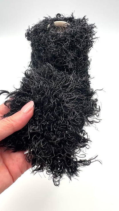 Fluffy fur merino silk yarn WISH GLOW chunky Italian yarn
luxury black fur effect yarn cone with grey fibers
soft fluffy merino silk yarn for jackets sweaters and scarves
dramatic textured chunky yarn close up luxury Italian yarn
statement fluffy fur yarn for couture knitting projects