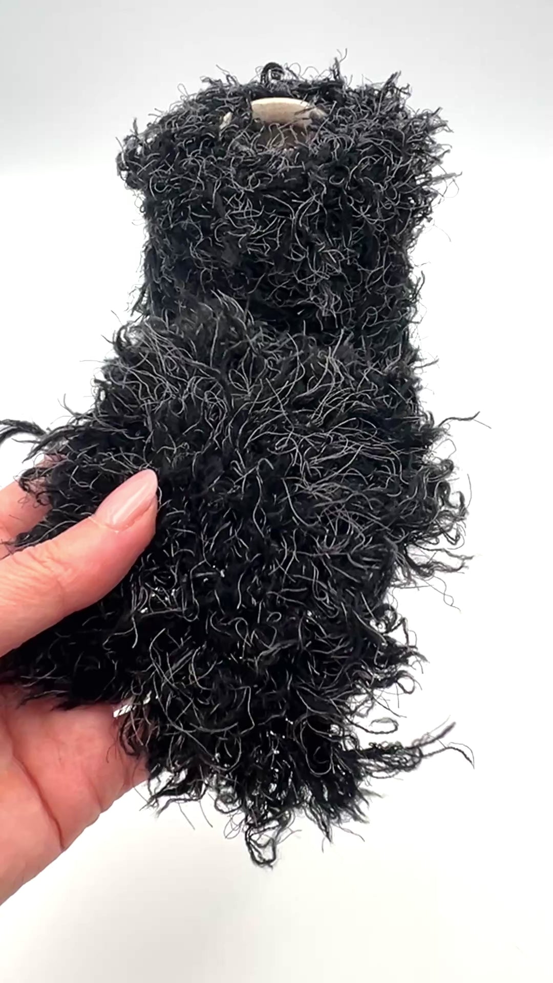 Fluffy fur merino silk yarn WISH GLOW chunky Italian yarn
luxury black fur effect yarn cone with grey fibers
soft fluffy merino silk yarn for jackets sweaters and scarves
dramatic textured chunky yarn close up luxury Italian yarn
statement fluffy fur yarn for couture knitting projects