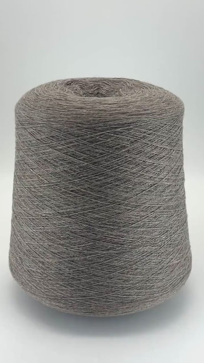 Loro Piana 100% Extra Fine Cashmere lace yarn (2/27 Nm) on a professional cone. Shown in classic neutral shades including Light Camel, Sand Melange, and Ivory. Made in Italy. Available at iDOKNiT.com.