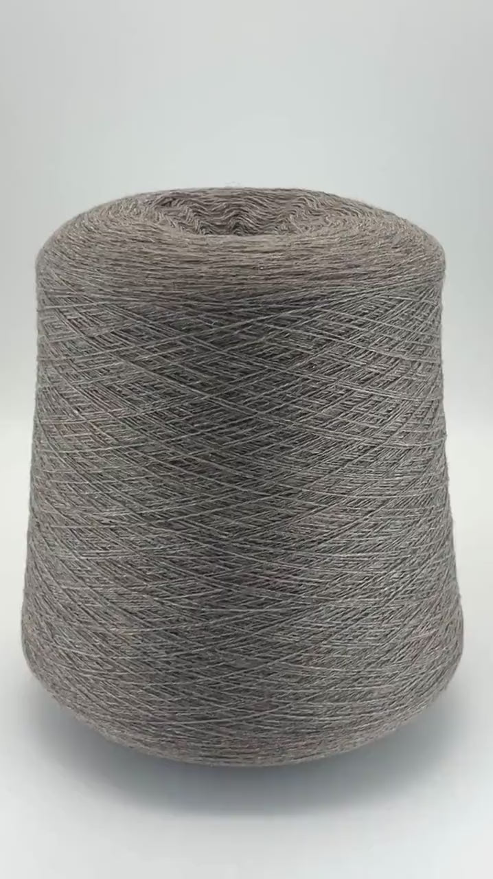 Loro Piana 100% Extra Fine Cashmere lace yarn (2/27 Nm) on a professional cone. Shown in classic neutral shades including Light Camel, Sand Melange, and Ivory. Made in Italy. Available at iDOKNiT.com.