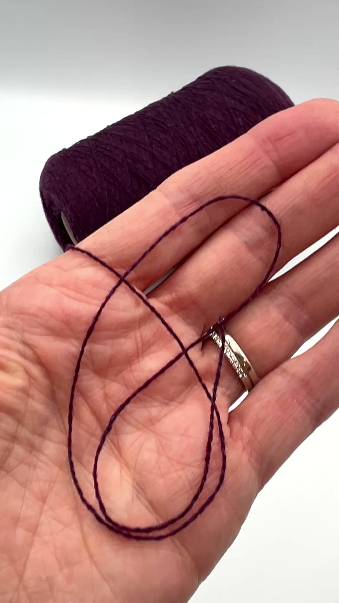 Loro Piana 50 percent baby vicuna 50 percent cashmere Italian ultra-fine lace yarn on original cone in Violetto Melange from iDOKNiT