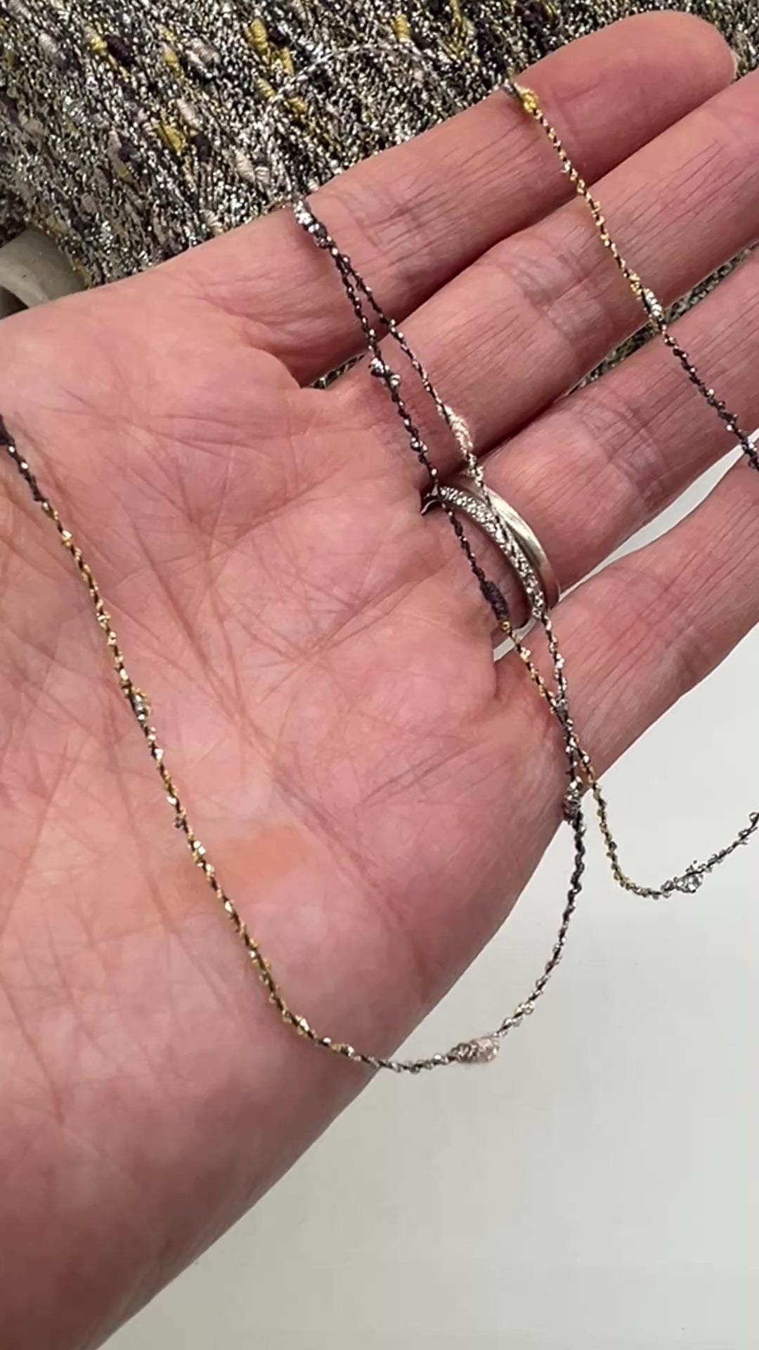 Exclusive iDOKNiT RiGo NODINO lace yarn featuring a radiant 67% viscose and 7% Lurex blend with a decorative Shishibriki texture for sophisticated Italian knitwear.