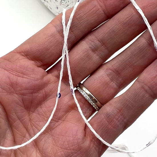 Professional grade RiGo STELLATO sport weight yarn from iDOKNiT, featuring a sophisticated 60% Italian cotton base with 2mm integrated paillettes. This authentic Italian-made yarn is curated by iDOKNiT to provide a refined shimmer and luxury finish for elegant, high-performance knitting projects.