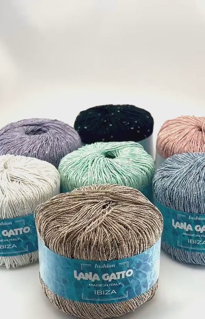 Lana Gatto IBIZA lurex cotton paillettes yarn with elegant sparkle
Italian fingering yarn IBIZA with micro sequins and metallic accents
Lana Gatto IBIZA summer yarn showing light-catching shimmer and texture
Lurex cotton paillettes yarn for beachwear summer tops and shawls
Luxury Italian IBIZA yarn for statement accessories and warm-weather knitwear