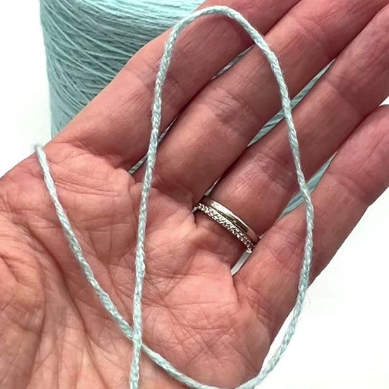 Elite iDOKNiT lace weight stretch yarn, SCOOBYGUM by Pecci Filati Italy. High-performance blend of 75% Cotton Makò and 25% Elastane, Nm 6500, providing 650m per 100g. Authentic Italian-made yarn in 2173 Pale Aqua, curated by iDOKNiT for lightweight garments requiring excellent elasticity, comfort, and shape retention.