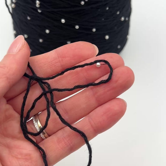 G&G Filati BON-BON luxury 100% merino wool single ply sport weight yarn featuring integrated, generously spaced perline pearl beads wound on an industrial cone for high-end boutique knitwear.
