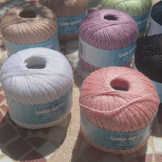 Lana Gatto GLOSSY linen viscose chain yarn Italian summer yarn
Luxury linen viscose yarn for breathable summer knitwear
Close up of GLOSSY chainette yarn showing airy texture and sheen
Italian flax viscose yarn for elegant lightweight garments
Soft summer chain yarn for tops shawls and modern knitwear