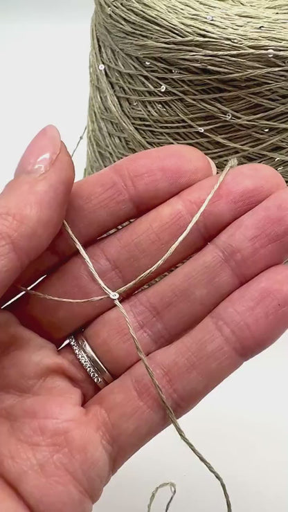 SAINT TROPEZ luxury yarn by RiGo, Italy – fingering weight blend of 80% linen, 15% silk, and 5% silver paillettes. Light, breathable, with a luminous sparkle. Ideal for elegant warm-weather knits.