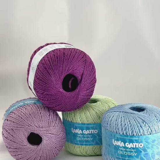 Lana Gatto GLOSSY linen viscose chain yarn Italian summer yarn
Luxury linen viscose yarn for breathable summer knitwear
Close up of GLOSSY chainette yarn showing airy texture and sheen
Italian flax viscose yarn for elegant lightweight garments
Soft summer chain yarn for tops shawls and modern knitwear