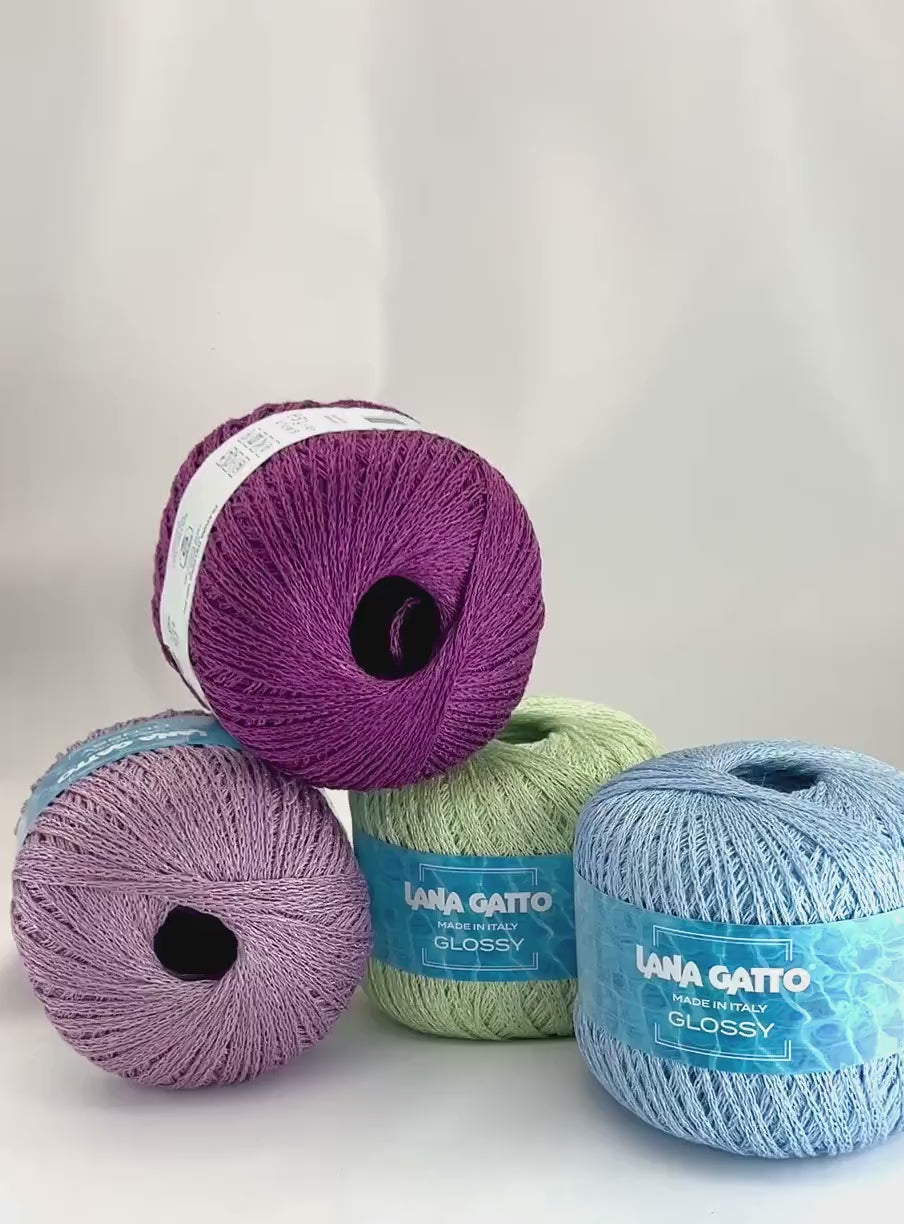 Lana Gatto GLOSSY linen viscose chain yarn Italian summer yarn
Luxury linen viscose yarn for breathable summer knitwear
Close up of GLOSSY chainette yarn showing airy texture and sheen
Italian flax viscose yarn for elegant lightweight garments
Soft summer chain yarn for tops shawls and modern knitwear