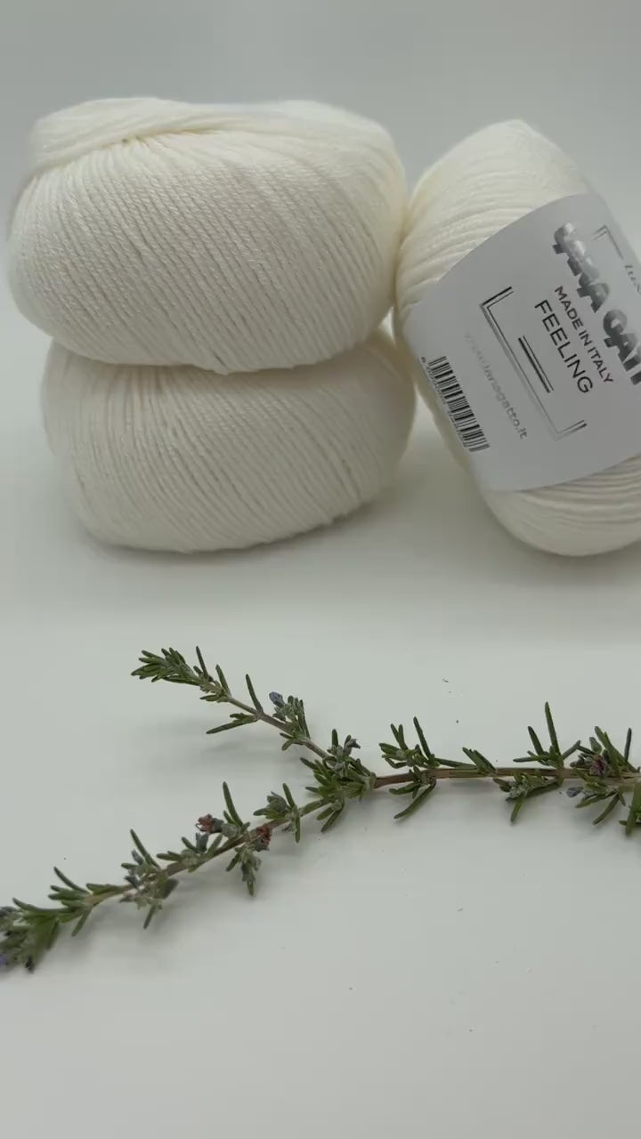 Lana Gatto FEELING cashmere silk merino yarn smooth shiny Italian sport yarn
Luxury Italian sport yarn FEELING soft drapey texture for sweaters and shawls
Close up of FEELING yarn showing smooth surface and silk sheen
Cashmere silk merino yarn FEELING ideal for scarves and garments
Soft luxury yarn FEELING perfect for refined knitwear projects