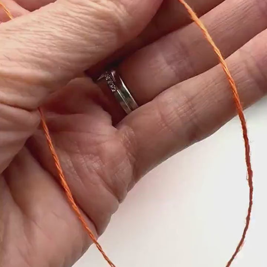 Premium iDOKNiT fingering weight yarn, FRESCOLINO by RiGo Italy. 100% pure linen fiber with an Nm 3/12 count, providing 400m per 100g. Authentic Italian-made plant fiber curated by iDOKNiT for breathable, long-lasting summer garments in vibrant shades like 1488 Orange and 1489 Beige.