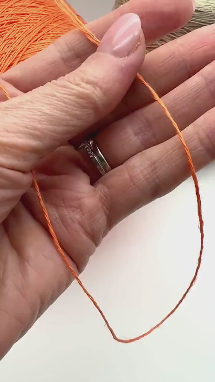 Premium iDOKNiT fingering weight yarn, FRESCOLINO by RiGo Italy. 100% pure linen fiber with an Nm 3/12 count, providing 400m per 100g. Authentic Italian-made plant fiber curated by iDOKNiT for breathable, long-lasting summer garments in vibrant shades like 1488 Orange and 1489 Beige.