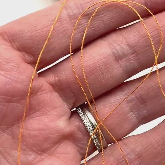 Emilcotoni Silk & Cotton lace yarn from Italy. Shown on professional cones in shades like Ochre, Navy Blue, and Brown. High-quality designer yarn for retail at iDOKNiT.com.