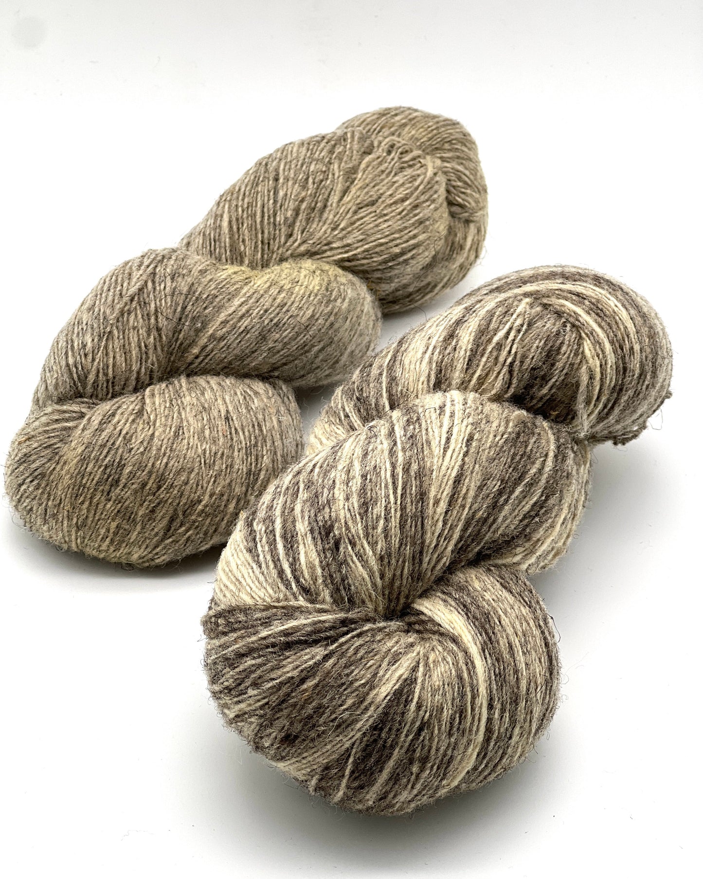 Exclusive iDOKNiT rustic fingering weight yarn, Romanov Sheep Wool from Paces Vilnas Fabrika, Latvia. 100% pure Romanov wool traditionally processed to retain 70% natural lanolin for extreme durability and weather resistance. Single-ply construction providing 420m per 100g. Curated by iDOKNiT in natural and tweed-effect dyed shades for heritage-style, hearty knitwear.